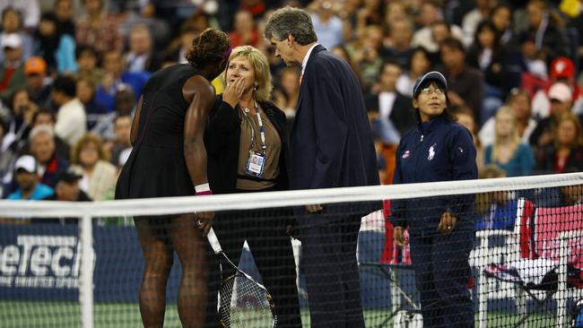 Serena Williams argues with Brian Early and Donna Kelso after threatening a lineswoman during the women's singles semifinal match against to Kim Clijsters at the 2009 US.