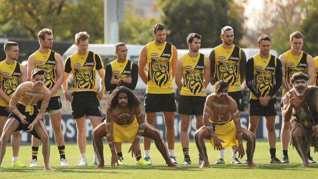 Richmond players watch a performance by the club's Korin Gamadji Institute.