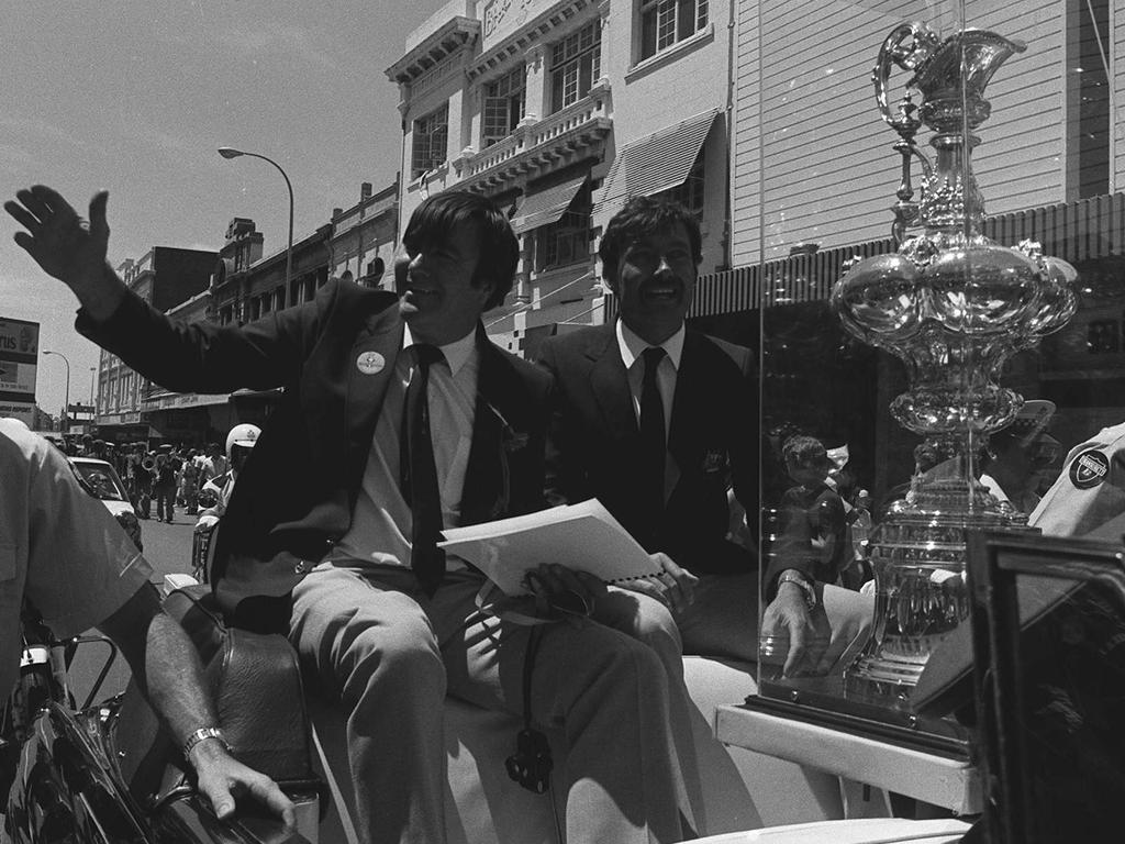 Winged-keel designer Ben Lexcen and Australia II skipper John Bertrand during the 1983 America's Cup street parade in Perth. Picture: Perth Sunday Times