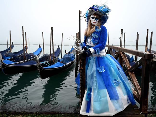 A masked participant strikes a pose at the pre-opening of the 2024 Venice Carnival, celebrating “Marco Polo’s Amazing Journey” from February 3-13. Picture: Gabriel Bouys/AFP