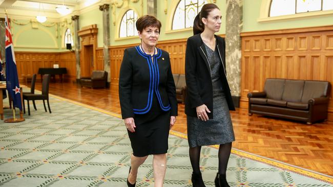 Prime Minister Jacinda Ardern, right, and Governor General Dame Patsy Reddy leave after signing a national condolence books at Parliament in Wellington today. Picture: Hagen Hopkins/Getty