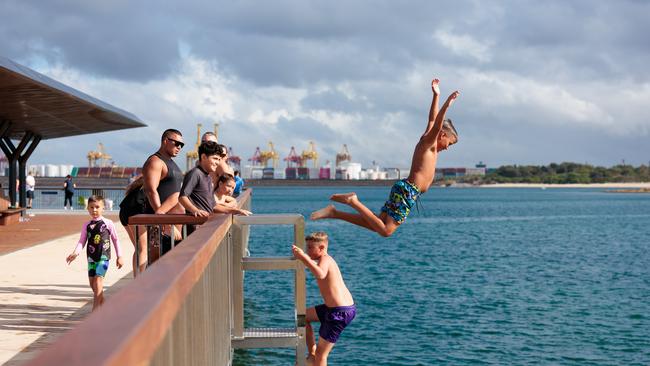 Kids jumping off the rebuilt wharf at La Perouse on Sunday. Picture: Chris Huang (Matrix)