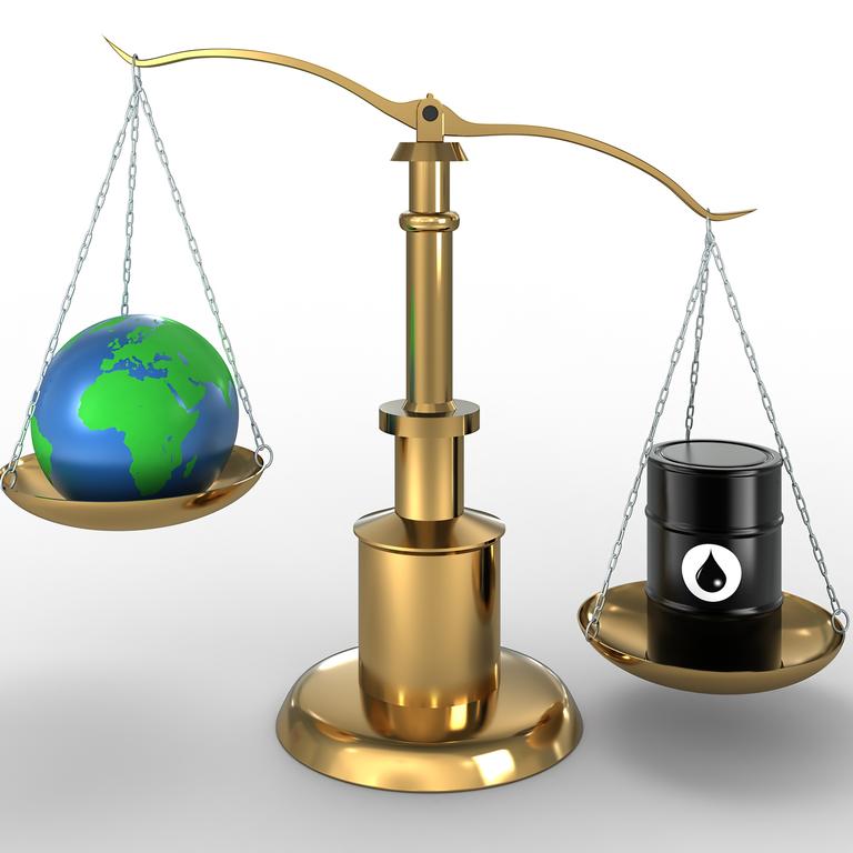 High quality 3d render of Barrel of Oil and Earth globe on scales. Detailed clipping path included.