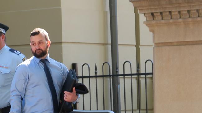 Detective Senior Constable Regan Doring leaves court after giving evidence in the case of Senior Constable Corey Ahling, who has been charged with assaulting a man. Picture: Ryan Young