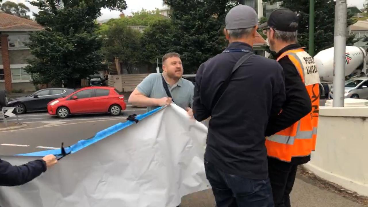 Moment commuter snaps at protesters