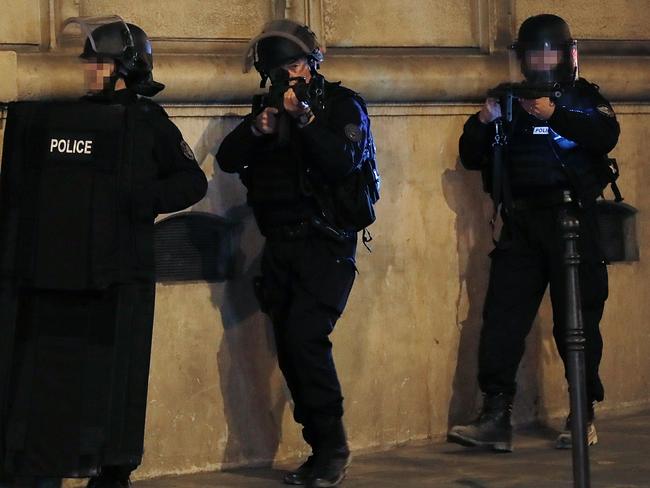 Police officers block the access of a street near the Champs Elysees in Paris after the terror attack.