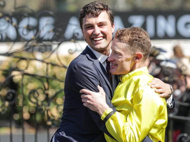 2023 Melbourne Cup Flemington. Running off the Melbourne Cup. Winning jockey Mark Zahra hugs trainer Sam Freedman during the presentation ceremony.     Picture: David Caird