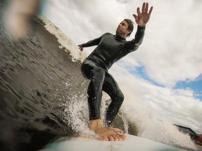 GoPro owner and creator Nick Woodman with the first prototype of the GoPro Hero. Nick thought up the invention while on a surfing trip around Australia Picture: Supplied/GoPro