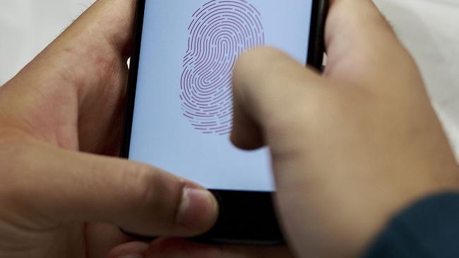 MADRID, SPAIN - SEPTEMBER, 16: A customer sets the Touch ID of his new Iphone 7 at Puerta del Sol Apple Store the day the company launches their Iphone 7 and 7 Plus on September 16, 2016 in Madrid, Spain. The iPhone 7 and iPhone 7 Plus has been launched on Friday September 16th in more than 25 countries. Customers have started to queue 38 hours before the opening of the store placed in the center of Madrid.  (Photo by Gonzalo Arroyo Moreno/Getty Images)