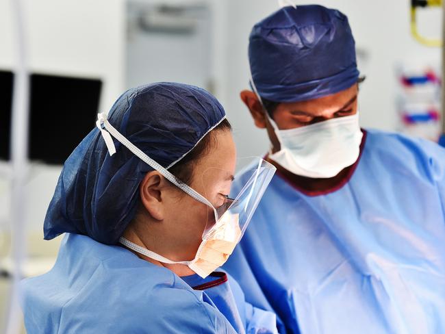 Surgeons Dr Nancy Suh and Ray Gafaar during the transplant. Picture: Ellen Smith