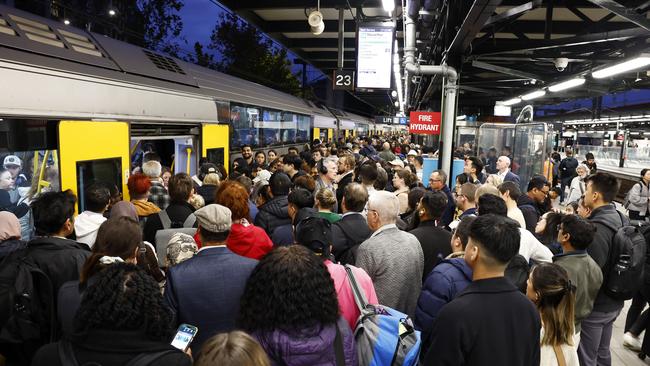 Commuters board a packed T8 line train on platform 23 at Central Station on Wednesday night. Picture: Jonathan Ng