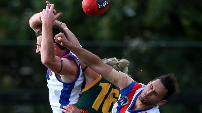 Brock McLennan of Northcote is sandwiched between two opponents during the NFL match between Northcote Park and West Preston-Lakeside played at Westgarth Street Oval on Saturday 23rd April, 2016. Picture: Mark Dadswell