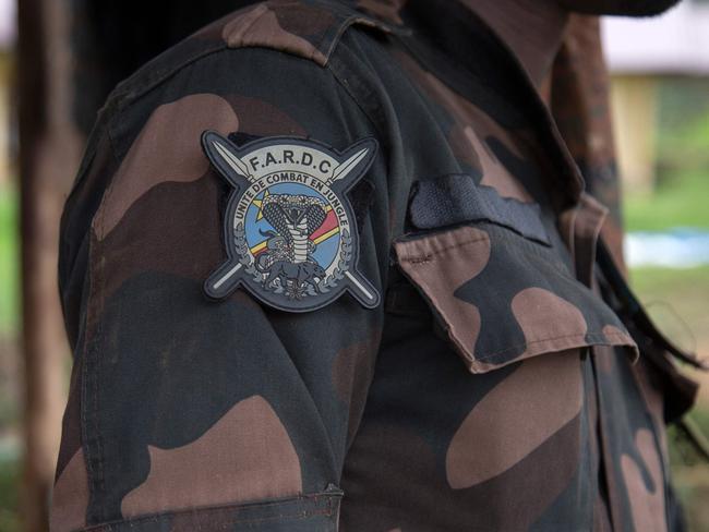 A general view of a badge of the Armed Forces of the Democratic Republic of the Congo (FARDC) on a soldier's sleeve in Lubero on December 26, 2024. (Photo by Seros MUYISA / AFP)