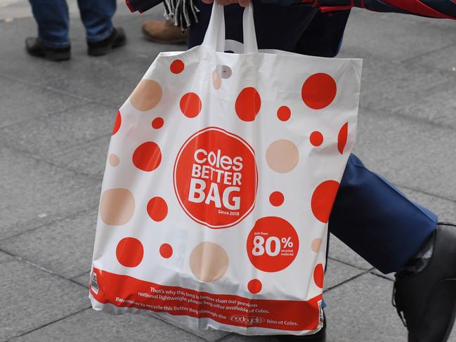 A shopper is seen carrying a reusable plastic bag at a Coles Sydney CBD store, Sydney, Monday, July 2, 2018. Woolworths says it will hand out free reusable bags for the next 10 days as its customers get used to its ban on single-use plastic bags. Woolies stores in NSW, Queensland, Victoria and Western Australia stopped providing free single-use plastic bags on June 20. (AAP Image/Peter RAE) NO ARCHIVING