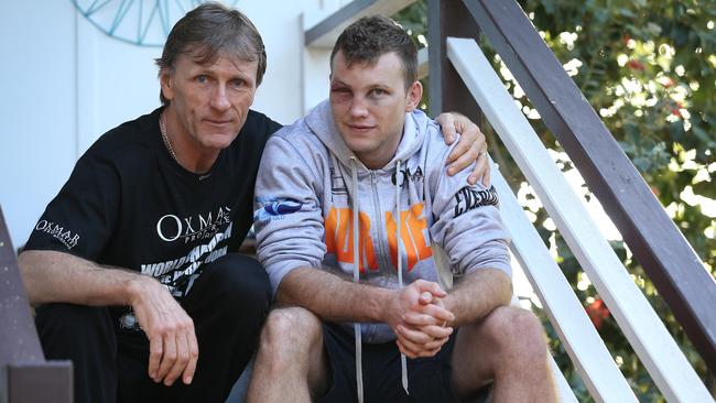 Jeff Horn reflects on his achievement with his trainer Glenn Rushton, at Jeff's home in Acacia Ridge, Brisbane yesterday. Picture: Lyndon Mechielsen.