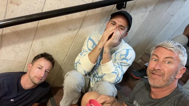 Hugh Sheridan, centre, shelters with friends including David Draper, right, in a Tel-Aviv hotel stairwell. Picture: Instagram/David Anthony Draper