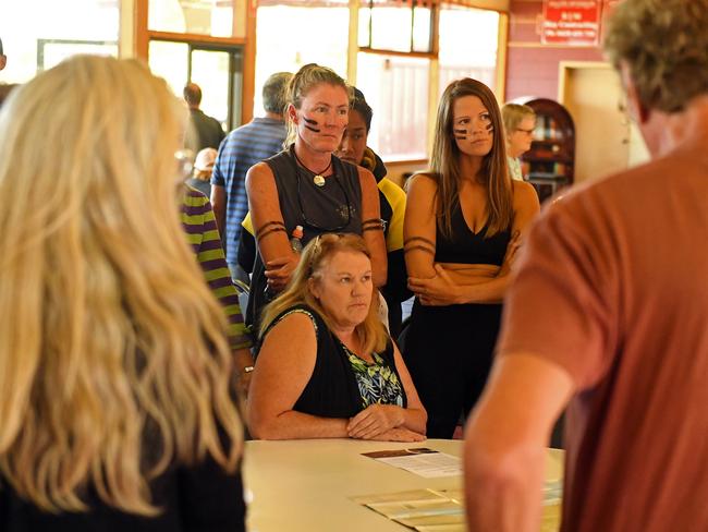 Residents Roanna Horbolt, left, and Becky Westbrook don war paint at Pardarna to raise concerns about the proposed development. Cheryl May is seated. Picture: Tom Huntley