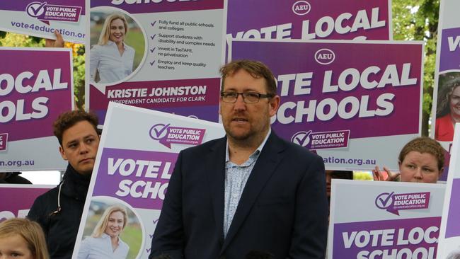 Australian Education Union Tasmania president David Genford and supporters at a media conference on parliament lawns in Hobart on Tuesday, April 20, 2021.