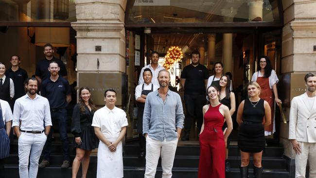 Justin Hemmes pictured with Merivale staff including Dan Hong, Jordan Toft and Nick Van Tiel outside the Establishment Bar on George St, Sydney. Picture: Jonathan Ng