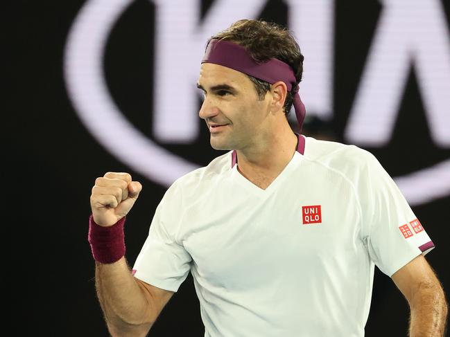 Switzerland's Roger Federer celebrates after victory against Hungary's Marton Fucsovics during their men's singles match on day seven of the Australian Open tennis tournament in Melbourne on January 26, 2020. (Photo by DAVID GRAY / AFP) / IMAGE RESTRICTED TO EDITORIAL USE - STRICTLY NO COMMERCIAL USE