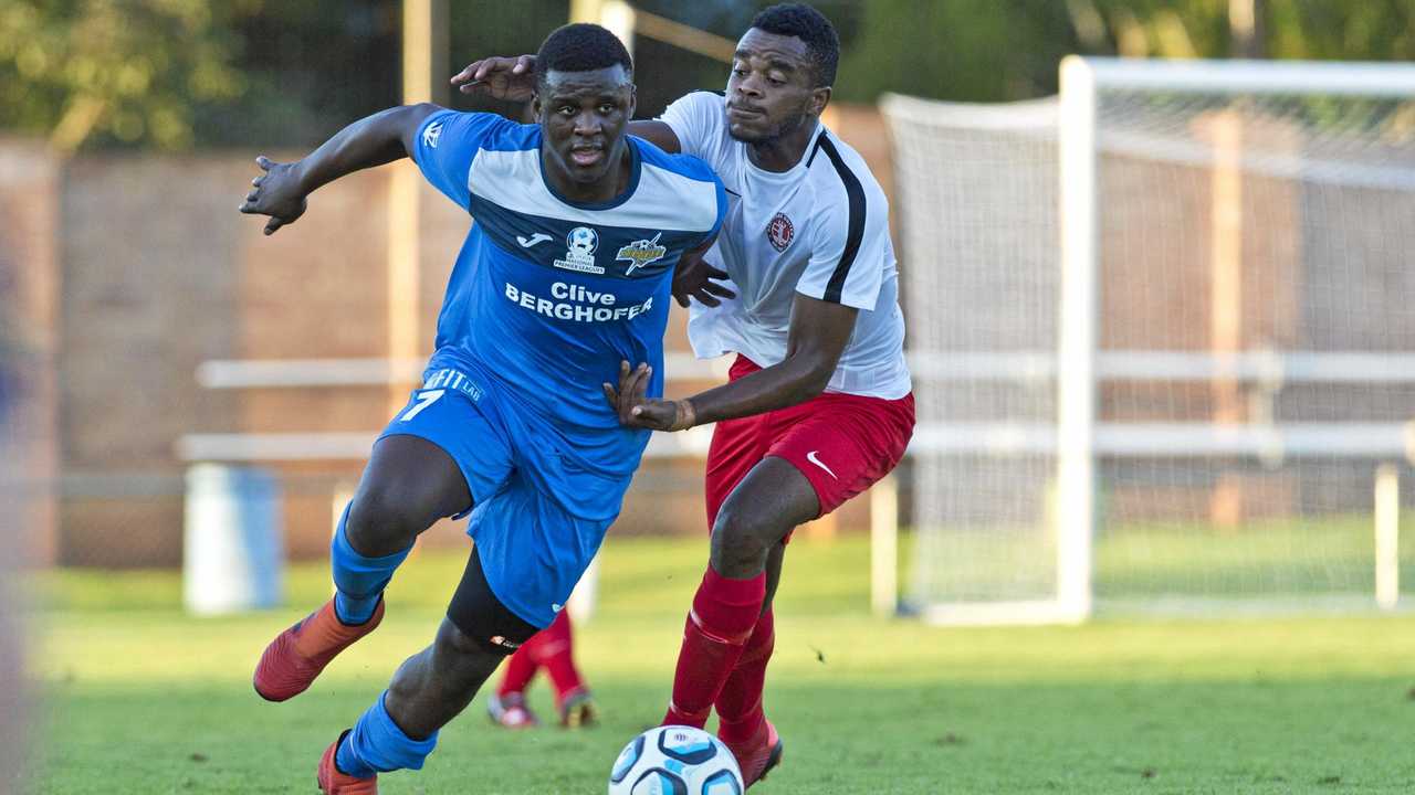 MIDFIELD MAESTRO: South West Queensland Thunder midfielder Kimba Kibombo (left) beats his Redlands United opponent during their NPLQ men's game at Clive Berghofer Stadium on Saturday. Kibombo scored two goals in the Thunder's 8-1 win. Picture: Kevin Farmer