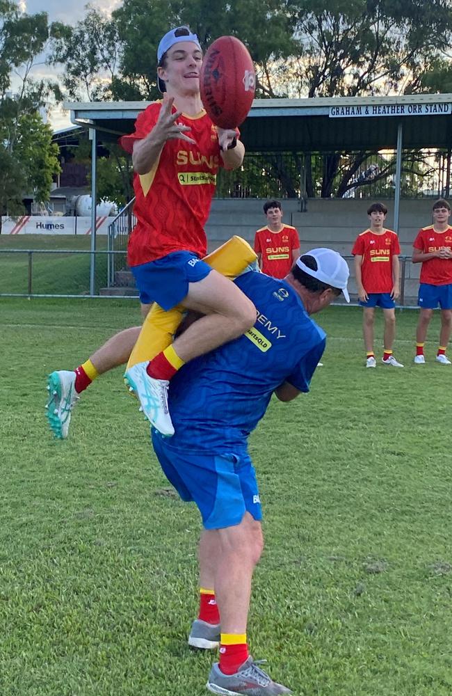 Gold Coast Suns Academy member Oliver Bennett flies high.