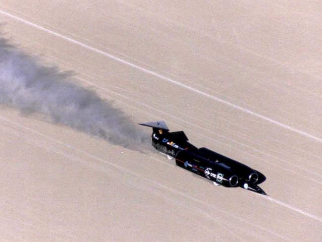 The very low flying British Thrust Supersonic Car driven by RAF pilot Squadron Leader Andy Green at the remote Black Rock Desert in Nevada in 1997. It’s fair to say, the Supercars won’t break Green’s record