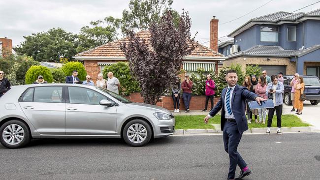 People tried to social distance at a Lalor auction on March 21. Picture: Tim Carrafa