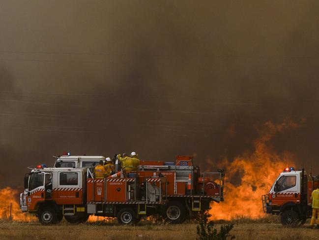 Fire crews work to contain a fire in Canberra on January 23. Picture: Rohan Thomson/Getty Images