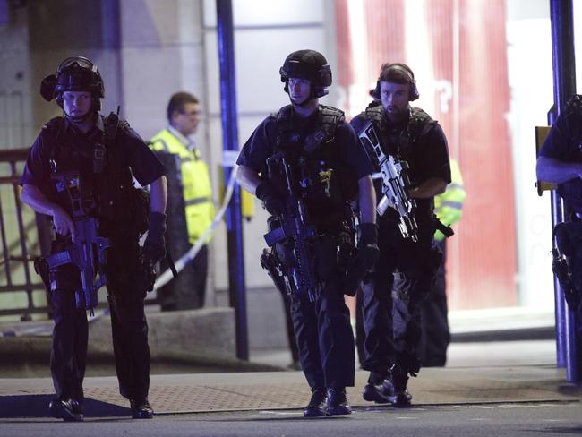 Armed police outside Monument station after an incident in central London. Picture: PA via AP