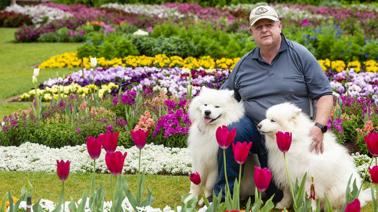 Zeus (left) and Sasha with owner Keith McGinn in Queens Park for the floral display for Carnival of Flowers 2022, Saturday, September 17, 2022. Picture: Kevin Farmer