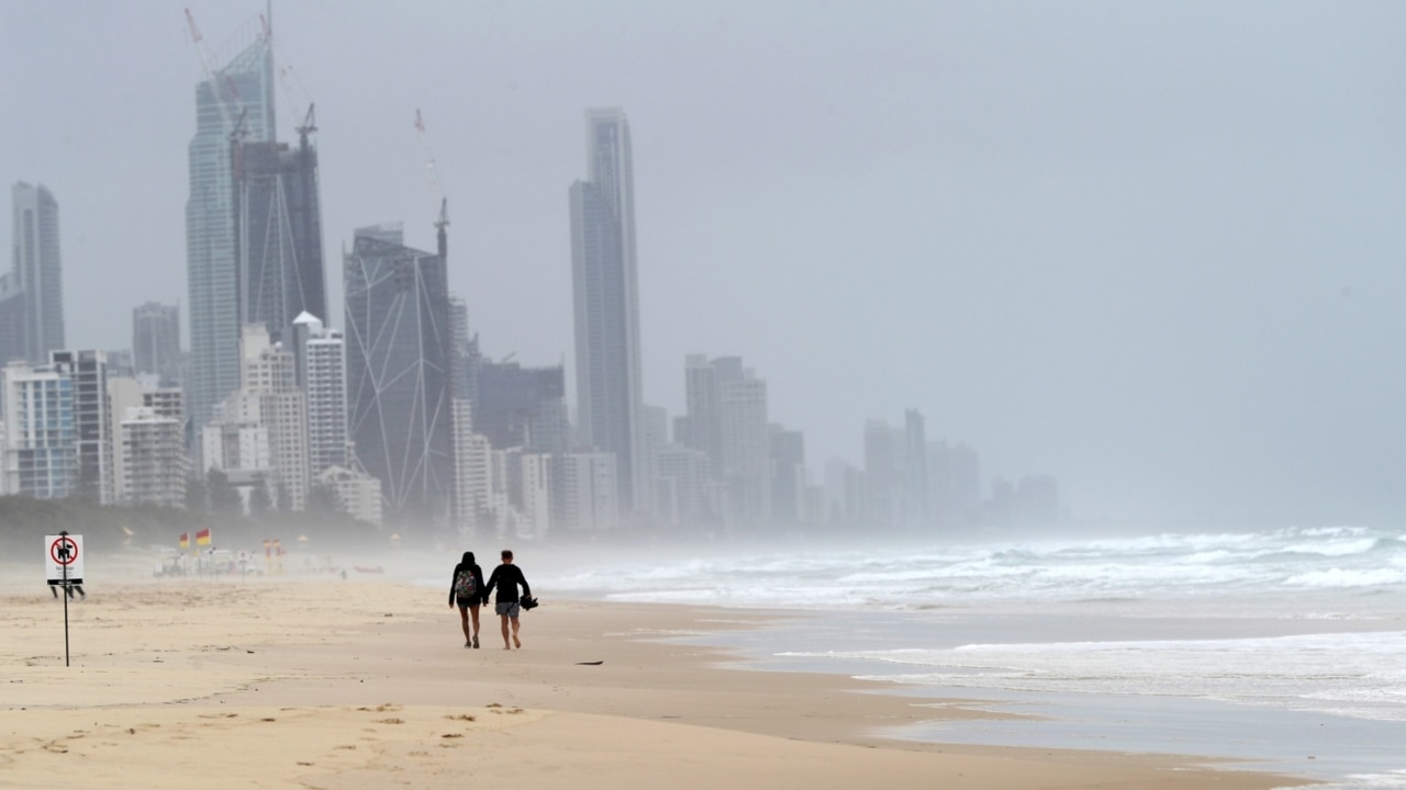 Beaches closed as huge swells batter Qld