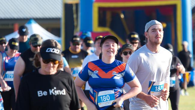 Paige Watts flanked by Callum Millar setting off for the 5km Run for MI Life. October 17, 2021 Picture: Marty Strecker