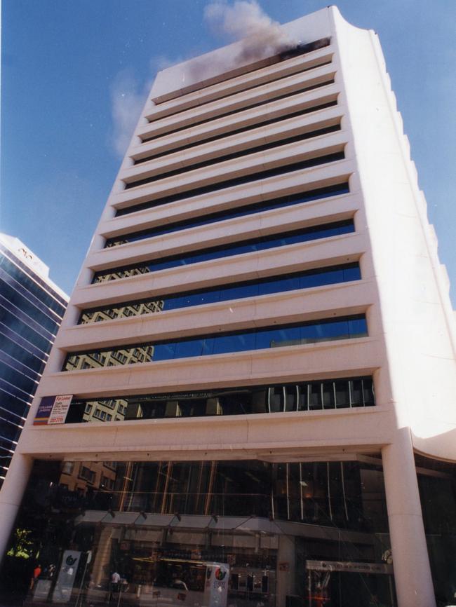 Smoke billows from top of the building after the explosion.