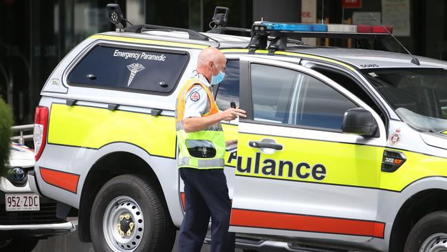 Paramedics transport guests in quarantine for the Hotel Grand Chancellor. Picture: Tara Croser.