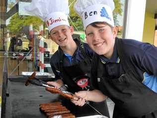 James Duggan and Ben Duffey cook up a storm on the barbecue. Picture: Frances Klein