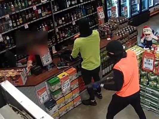 Victoria Police are stepping up their search for two armed robbers who held up a Williamstown liquor store up at gun point in December 23 last year.