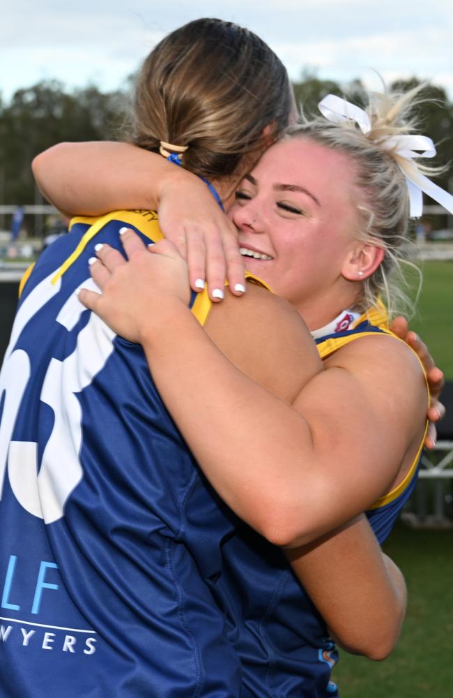 Bond University players Ava Usher and Havana Harris hugging after winning the QAFLW premiership. Picture: Cavan Flynn.