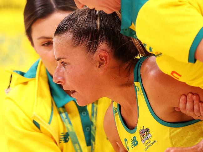 SYDNEY, AUSTRALIA - OCTOBER 30: Maddy Proud of Australia is helped to her feet during game two of the International Test series between the Australia Diamonds and the England Roses at Qudos Bank Arena on October 30, 2022 in Sydney, Australia. (Photo by Mark Kolbe/Getty Images for Netball Australia)