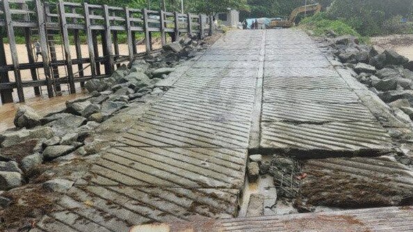 A ramshackled boat ramp at Dauan Island showing a lifted concrete section.