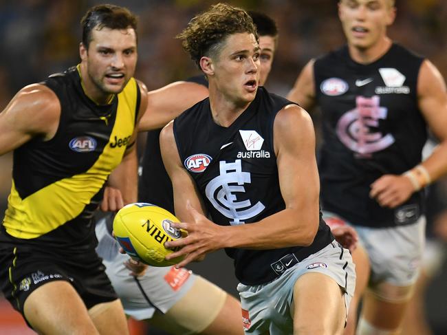 Charlie Curnow (third from left) of the Blues is seen in action during the Round 1 AFL match between the Richmond Tigers and the Carlton Blues at the MCG in Melbourne, Thursday, March 22, 2018. (AAP Image/Julian Smith) NO ARCHIVING, EDITORIAL USE ONLY