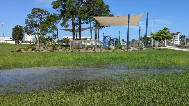 Waterlogging beside the fenced off playground. Picture: Keith Woods.