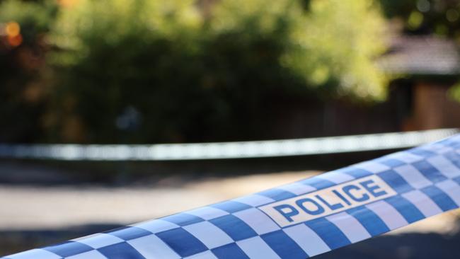 Police tape at the scene of a fatal house fire on Giltinan Place, in the ACT suburb of Holt. on May 22, 2024. Picture: Blake Foden