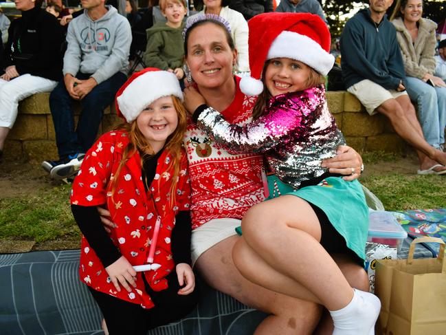 Evanthe, Maria Young and Jacqueline getting festive at the Phillip Island Christmas Carols by the Bay at the Cowes Foreshore on Tuesday, December 10, 2024. Picture: Jack Colantuono