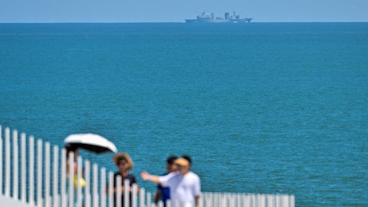 A Chinese military vessel off Pingtan island in the Taiwan Strait. (Photo by Hector RETAMAL / AFP)