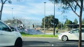 A skater and bike rider at All Nations park in Northcote.