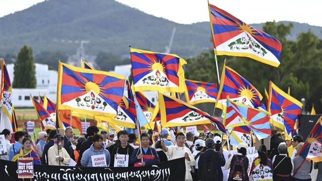 Free Tibet protesters on the lawn at Parliament House in Canberra on Wednesday. Picture: NCA NewsWire / Martin Ollman