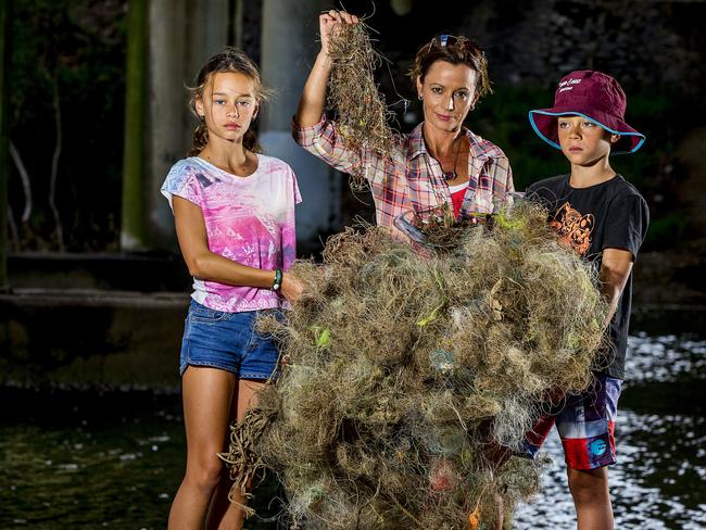 Fiona Byres and her 2 children, Kali, 10, and Soma, 10,  have been picking up bits of abandoned fishing line and equipement up and down Tallebudgera Creek.   Picture: Jerad  Williams