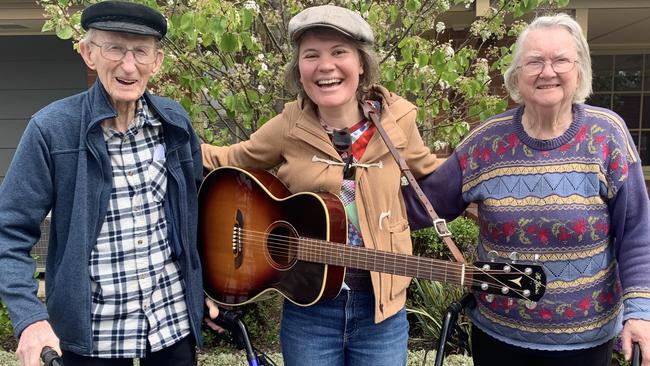 Award-winning singer songwriter Kelly Menhennett is spreading joy as a musician in residence at an aged-care provider. She is pictured here with residents Bill Reschke, 95, and Beth Fatchen, 82. Picture: supplied