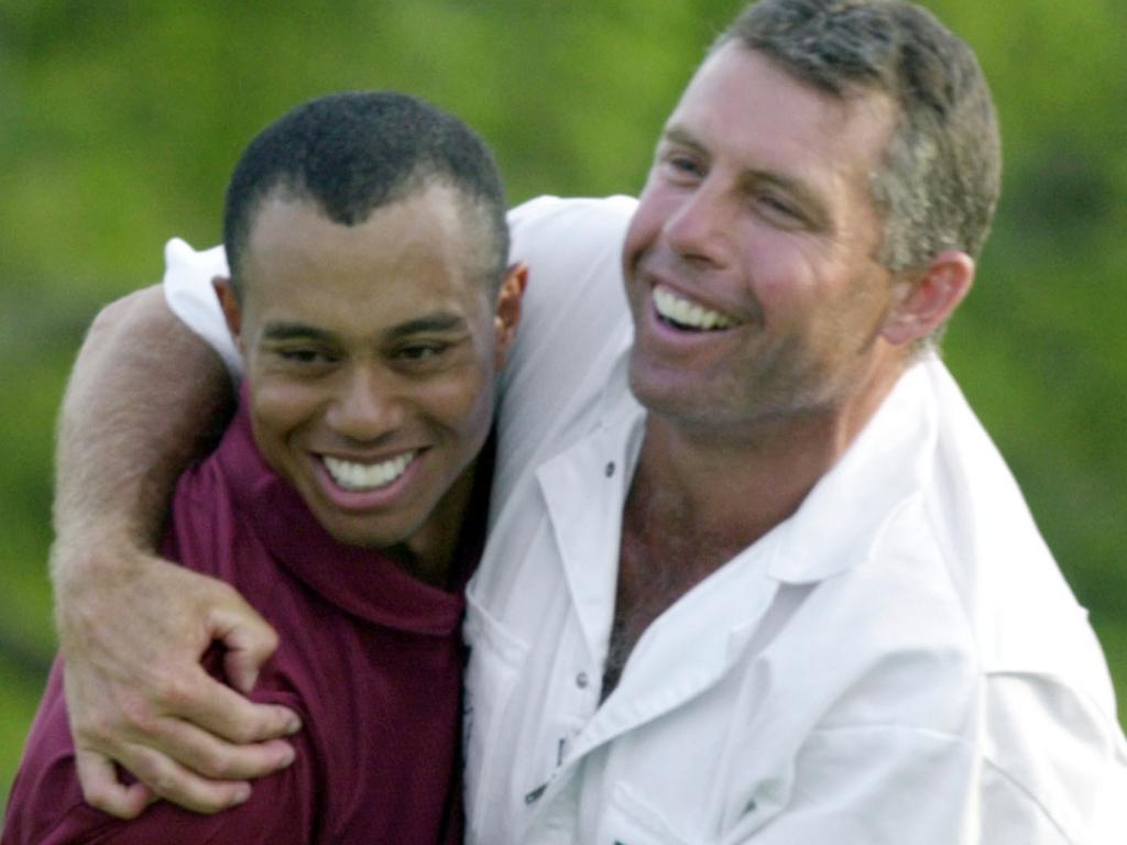 Tiger Woods hugged by caddie Steve Williams at Augusta National